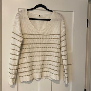 White with gold sweater